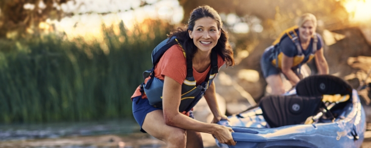 Woman camping in the woods