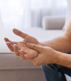 Hands with joint tenderness from psoriatic arthritis