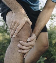 Knee experiencing physical impact of psoriatic arthritis with dactylitis or enthesitis